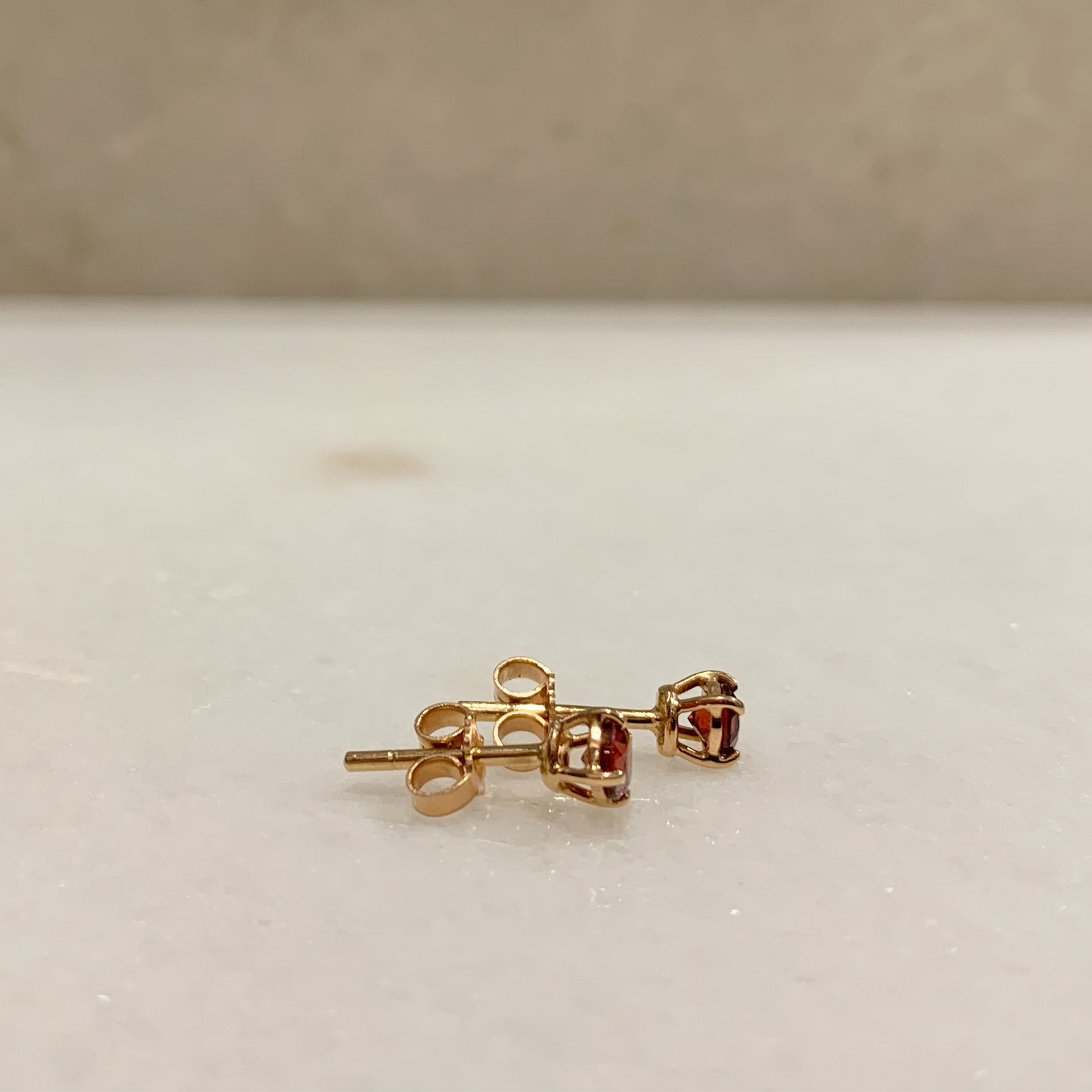 Punti luce in Oro Rosa e granato